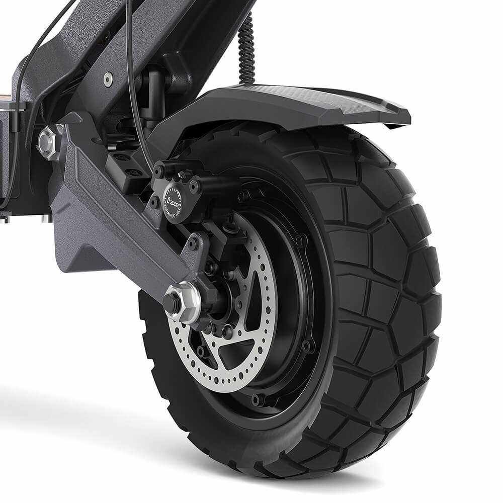 Rear wheel of the Ausom DT2 Pro — off-road tire, hub motor, and disc brake