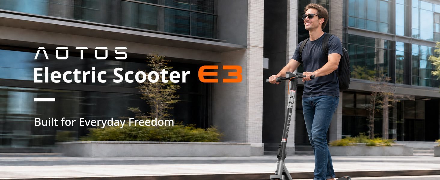 Rider on an AOTOS E3 folding electric scooter outside an office building