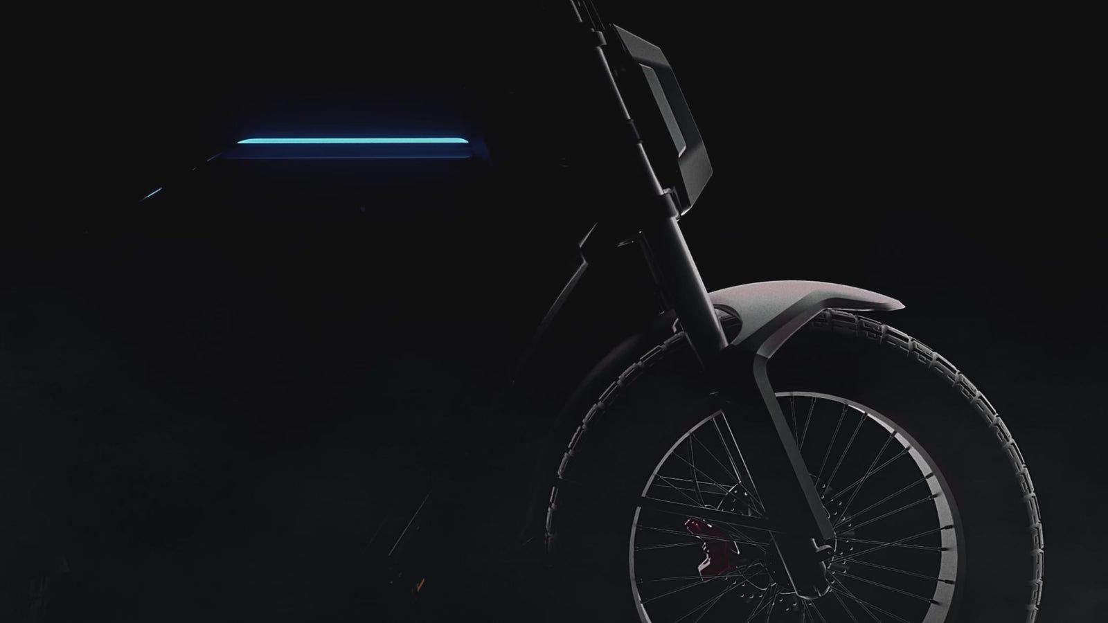 AOTOS FLUX X26 fat tire electric bike, front wheel and lit frame in the dark