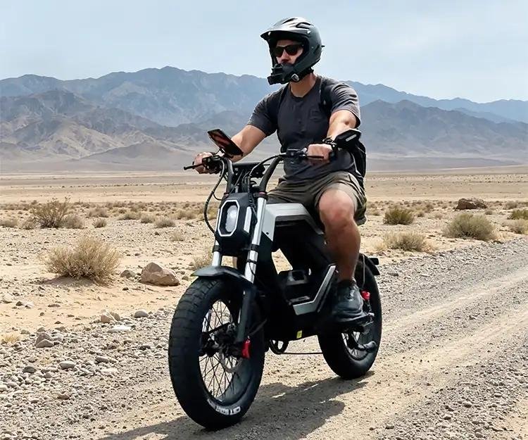 Rider on a FLUX X26 fat tire electric bike on a desert road