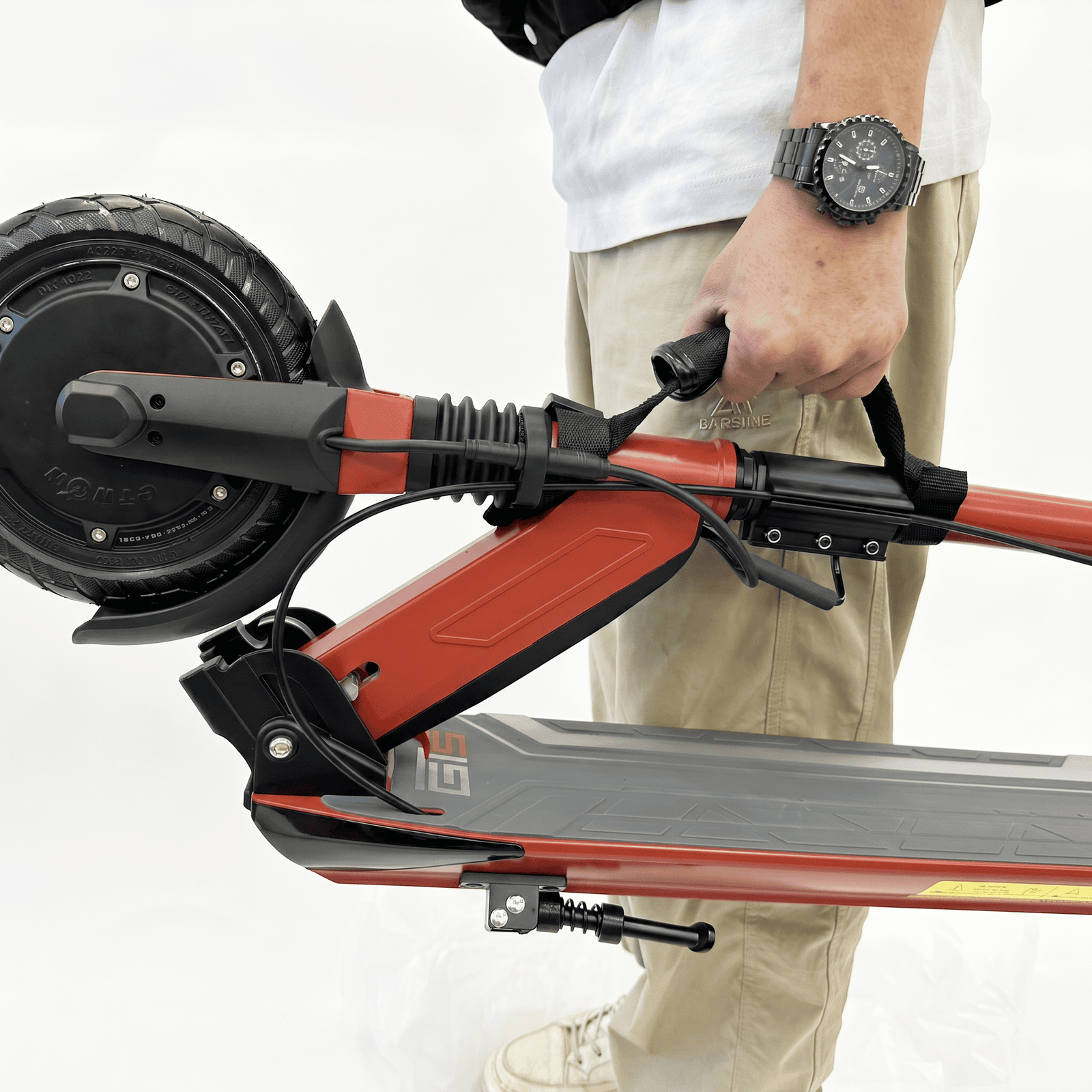 Carrying a folded GT Sport by its handle