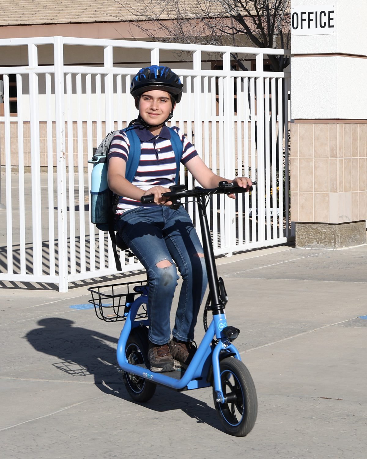 Young rider in a helmet on a blue Gyroor C1