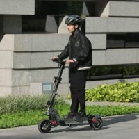 Rider on an electric scooter wearing the vented helmet