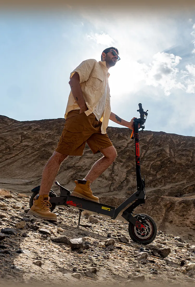 Rider pushing the G2 Ultra up a rocky hill