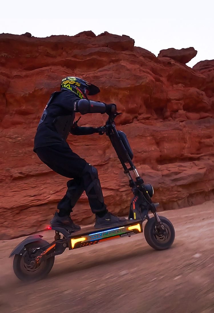 Rider on the G4 Max in a red rock canyon