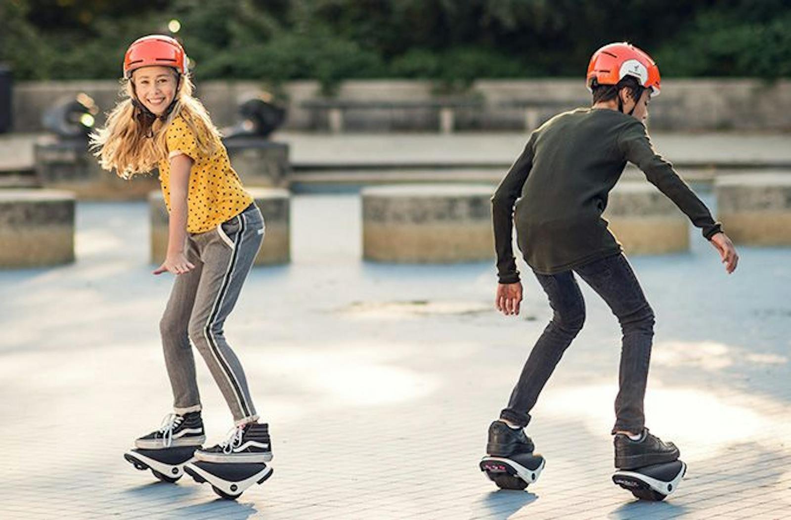 Two kids riding in Segway kids helmets