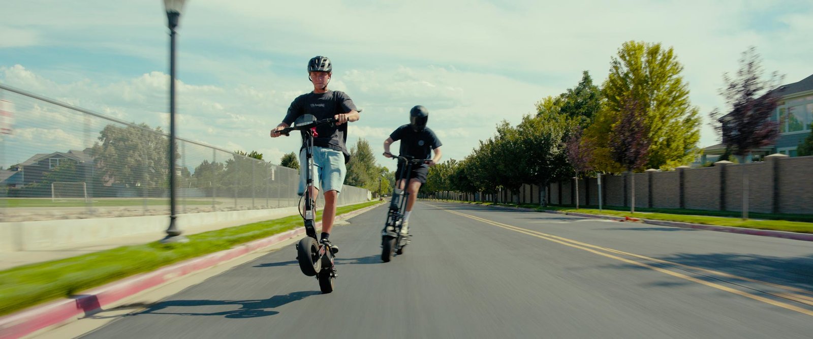 Two riders on Teewing electric scooters